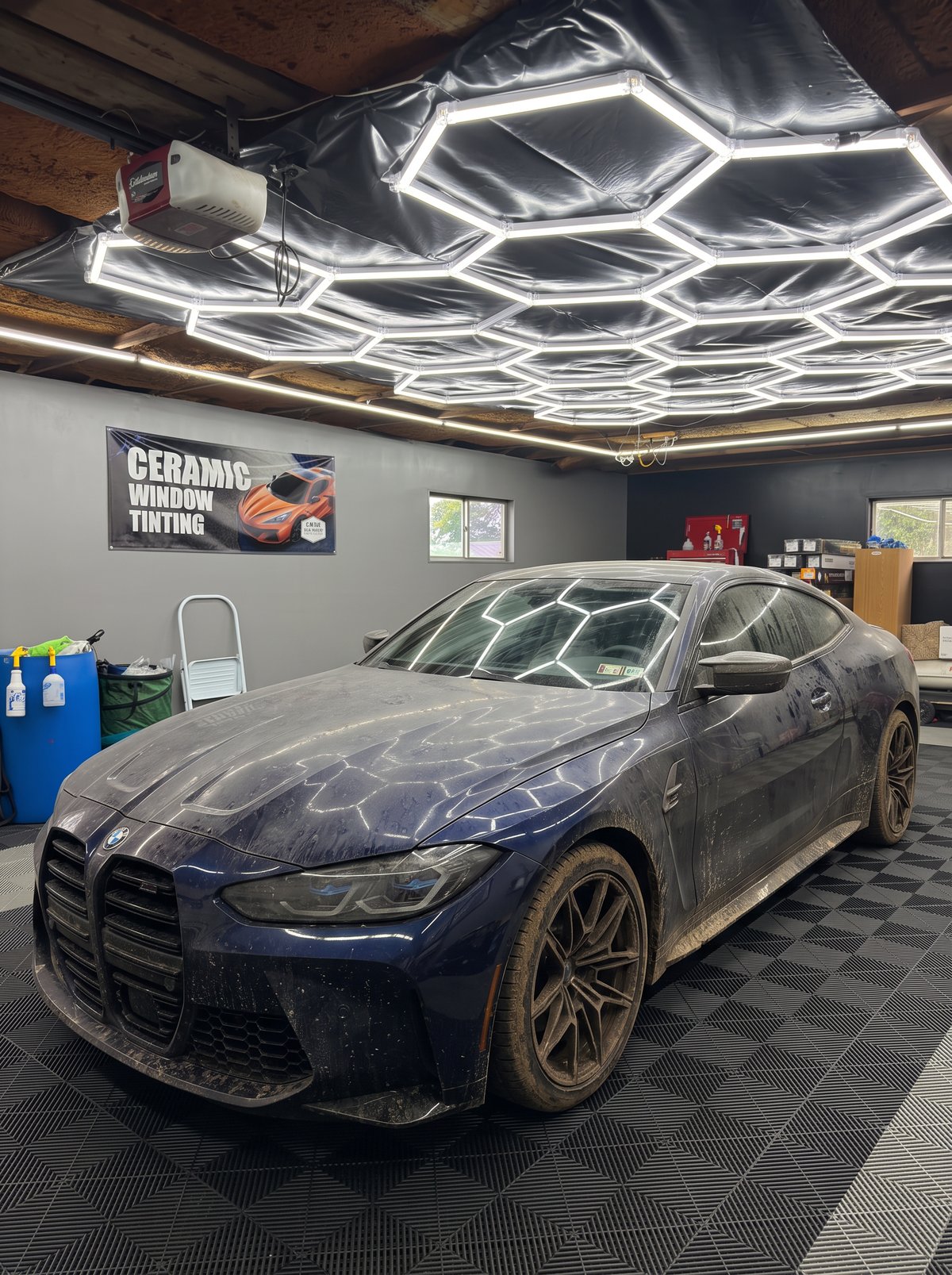 The same BMW M4 shown dirty and dull before detailing